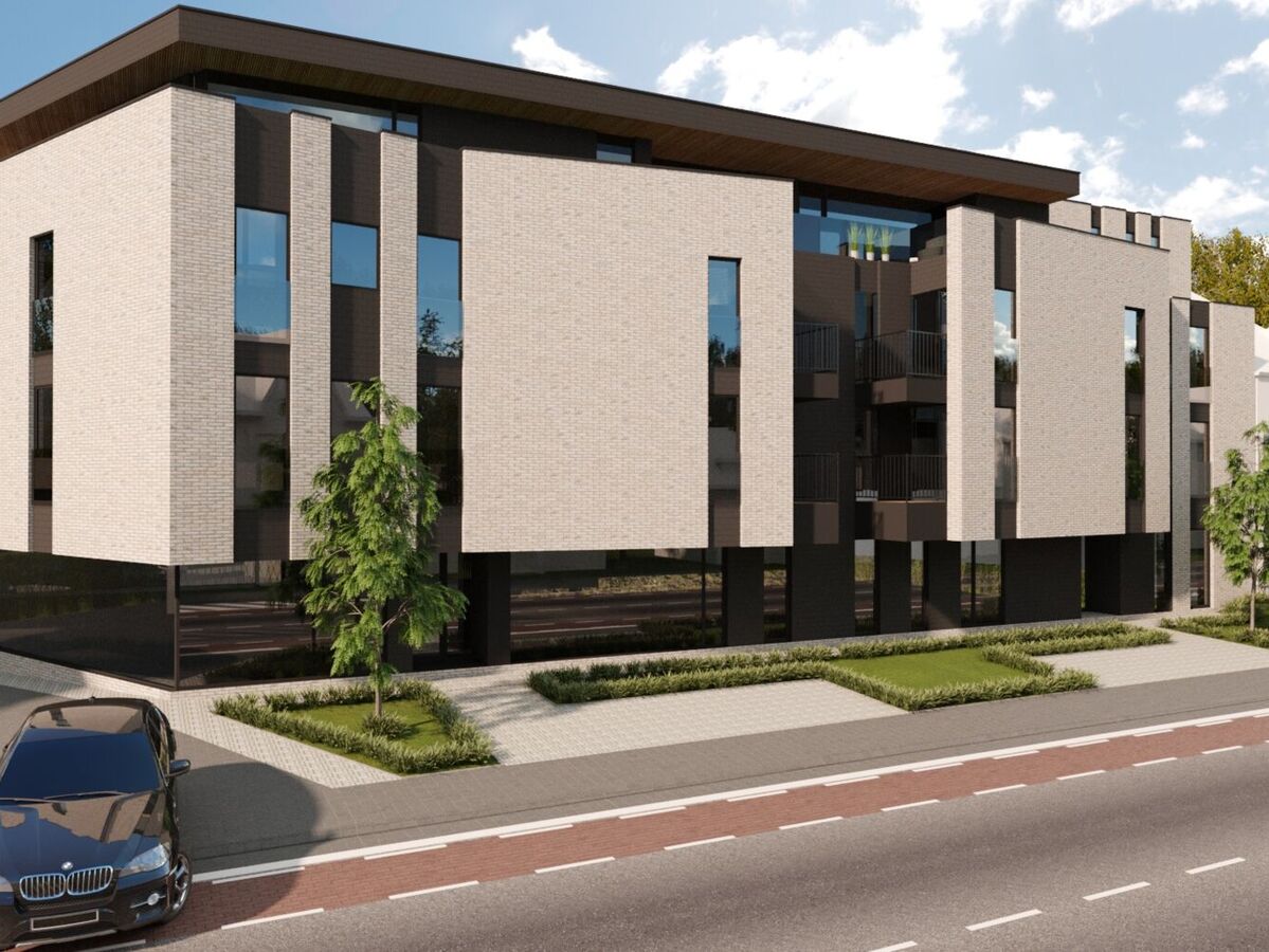 Ontwerpbeeld van het gebouw van W-Care langs de Tongersesteenweg, met groen en een fietspad