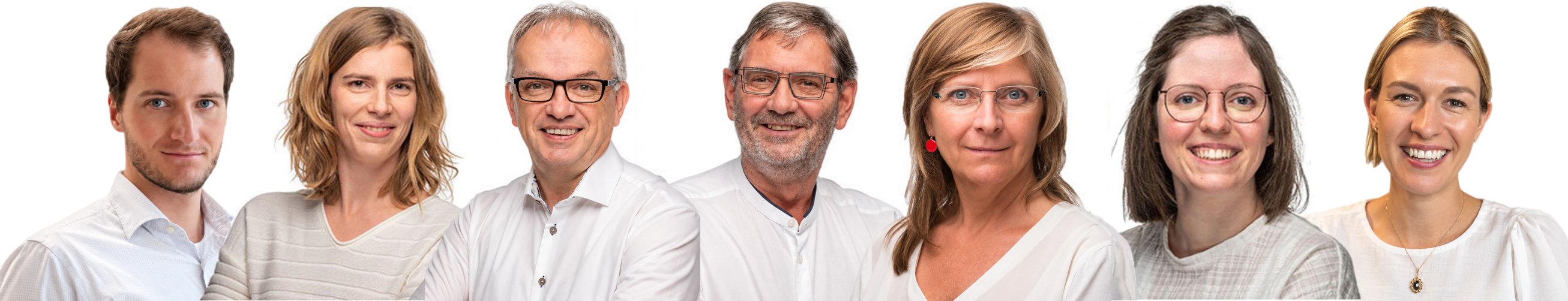Groepsfoto van de huisartsen van W-Care. Van links naar rechts: Dr. Christof Dierick, Dr. Ruth Bollen, Dr. Roland Jacobs, Dr. Walter Callebaut, Dr. Yasmine Maene, Dr. Elien Hermans en Dr. Gwen Krist.